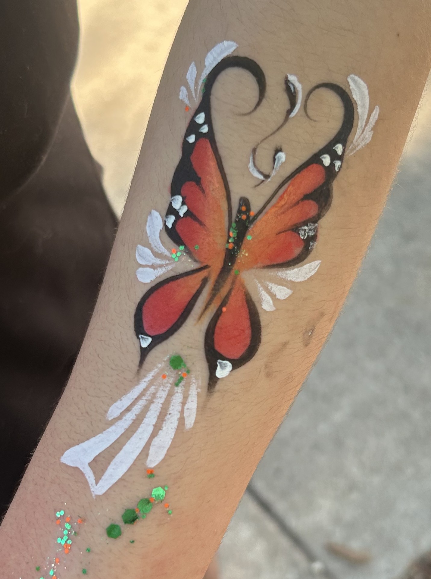 Orange butterfly face painting design