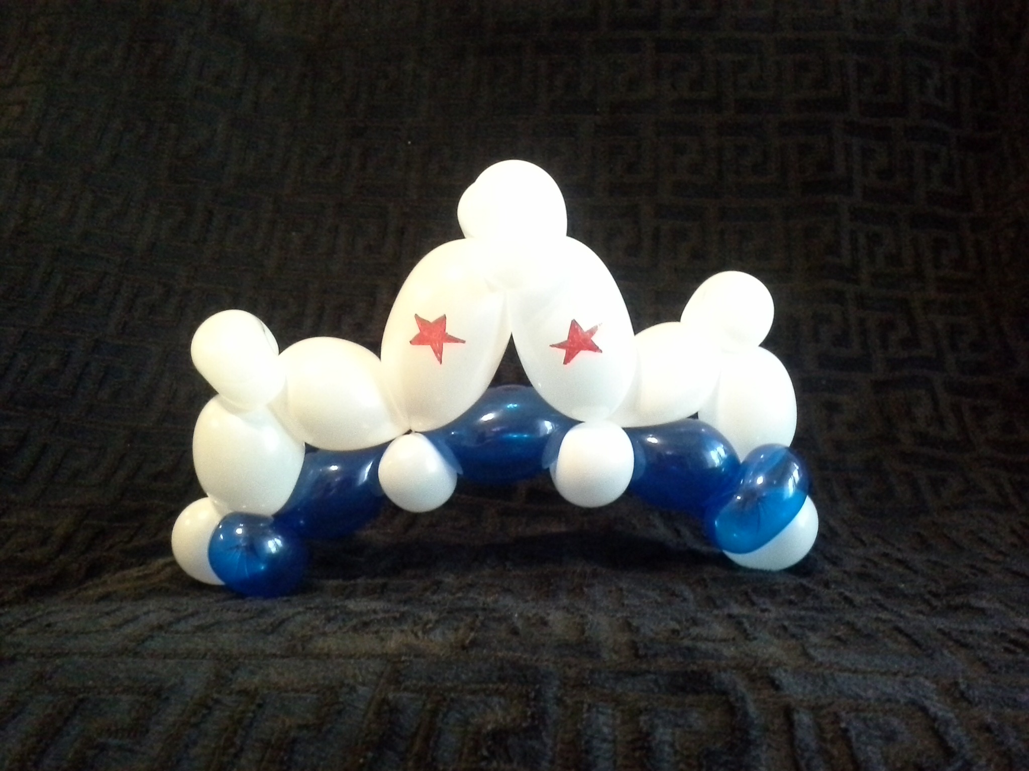 Blue and white balloon hat with red stars