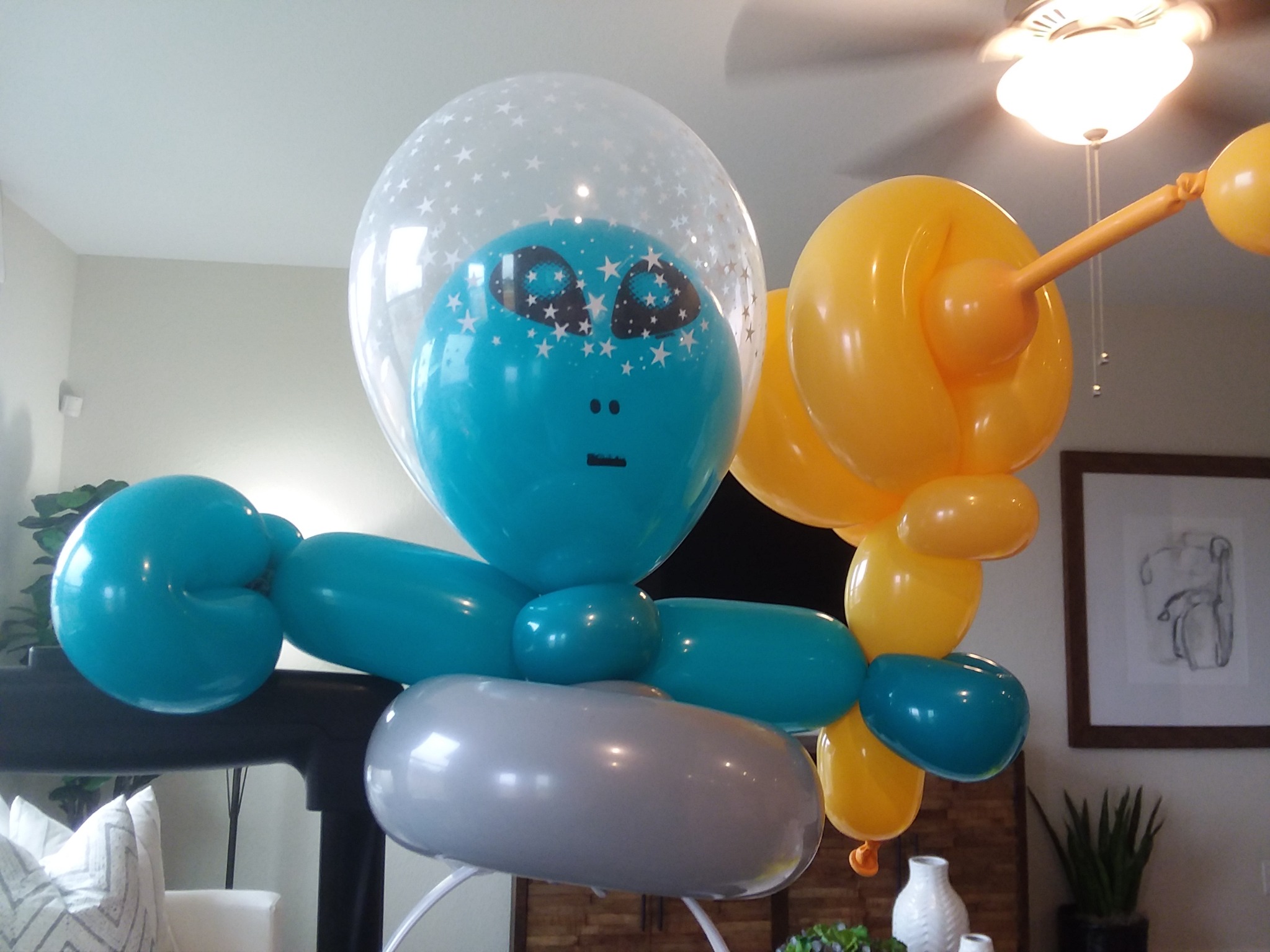 Blue and yellow balloon character sculptures
